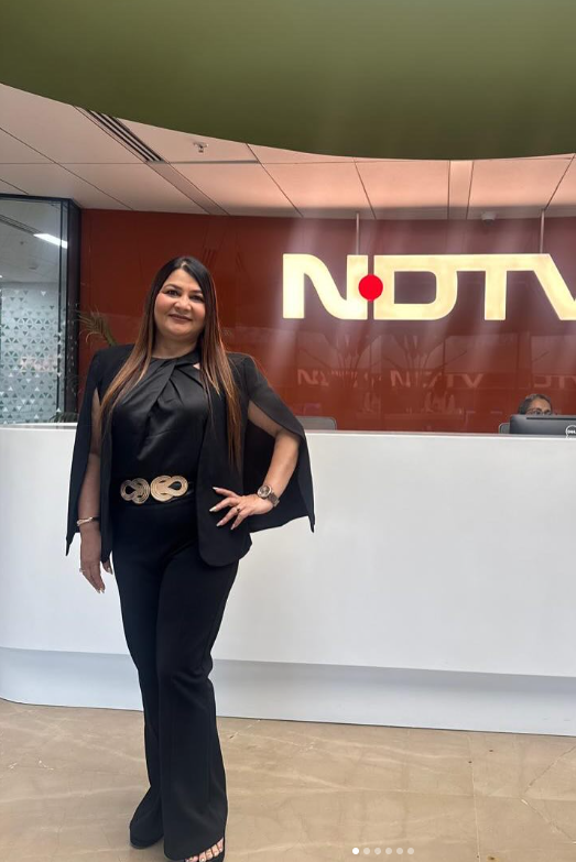 Woman in front of NDTV logo